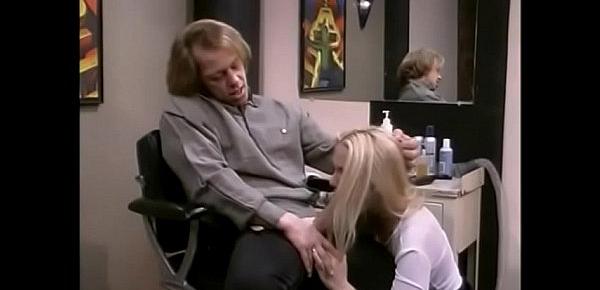  Blonde slut Ava Vincent in a little blackskirt gets penetrated in the barber seat